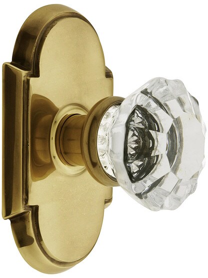 Arched Rosette Set With Fluted Crystal Knobs in Antique Brass.